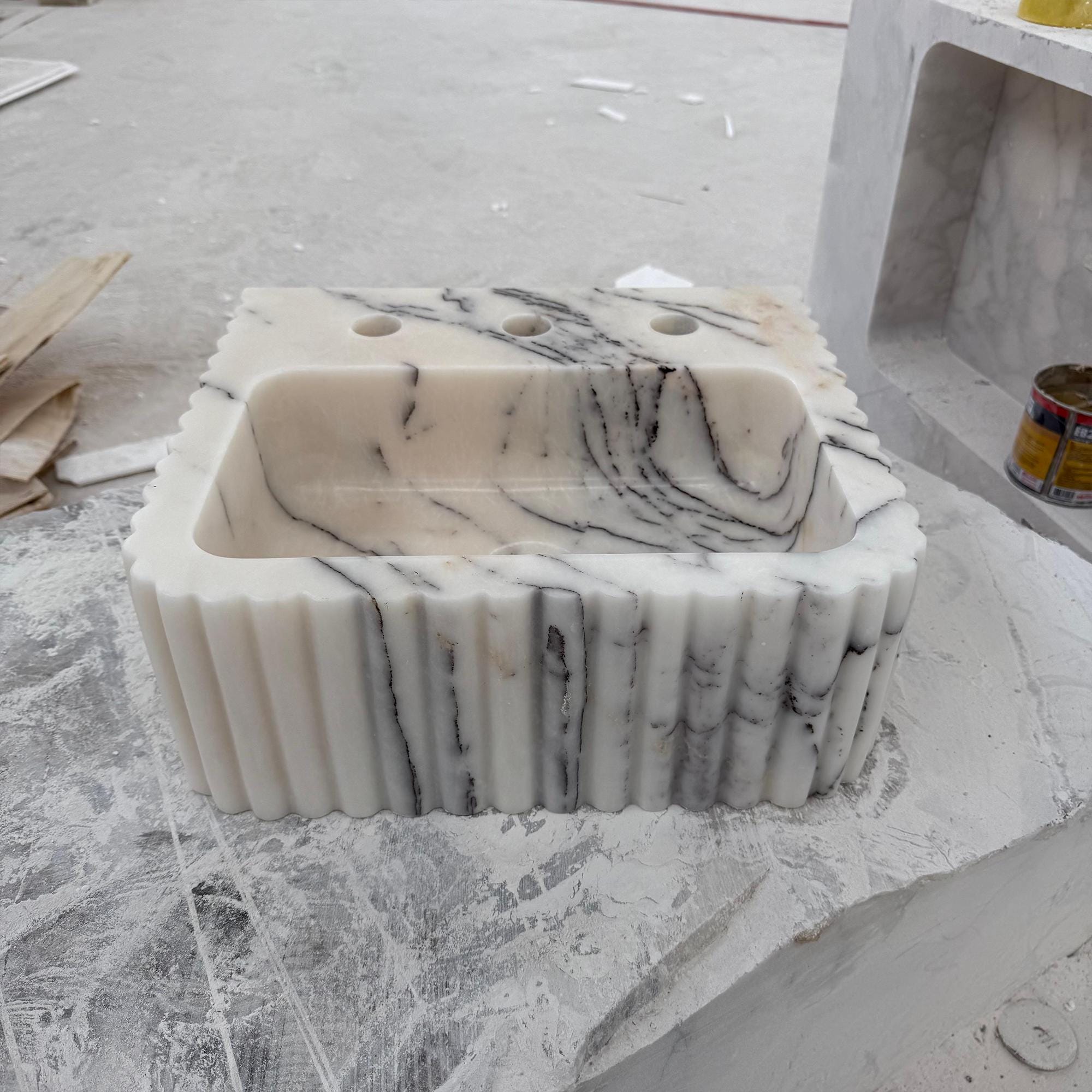 Premium Calacatta sink with bold natural veining and triple tap holes