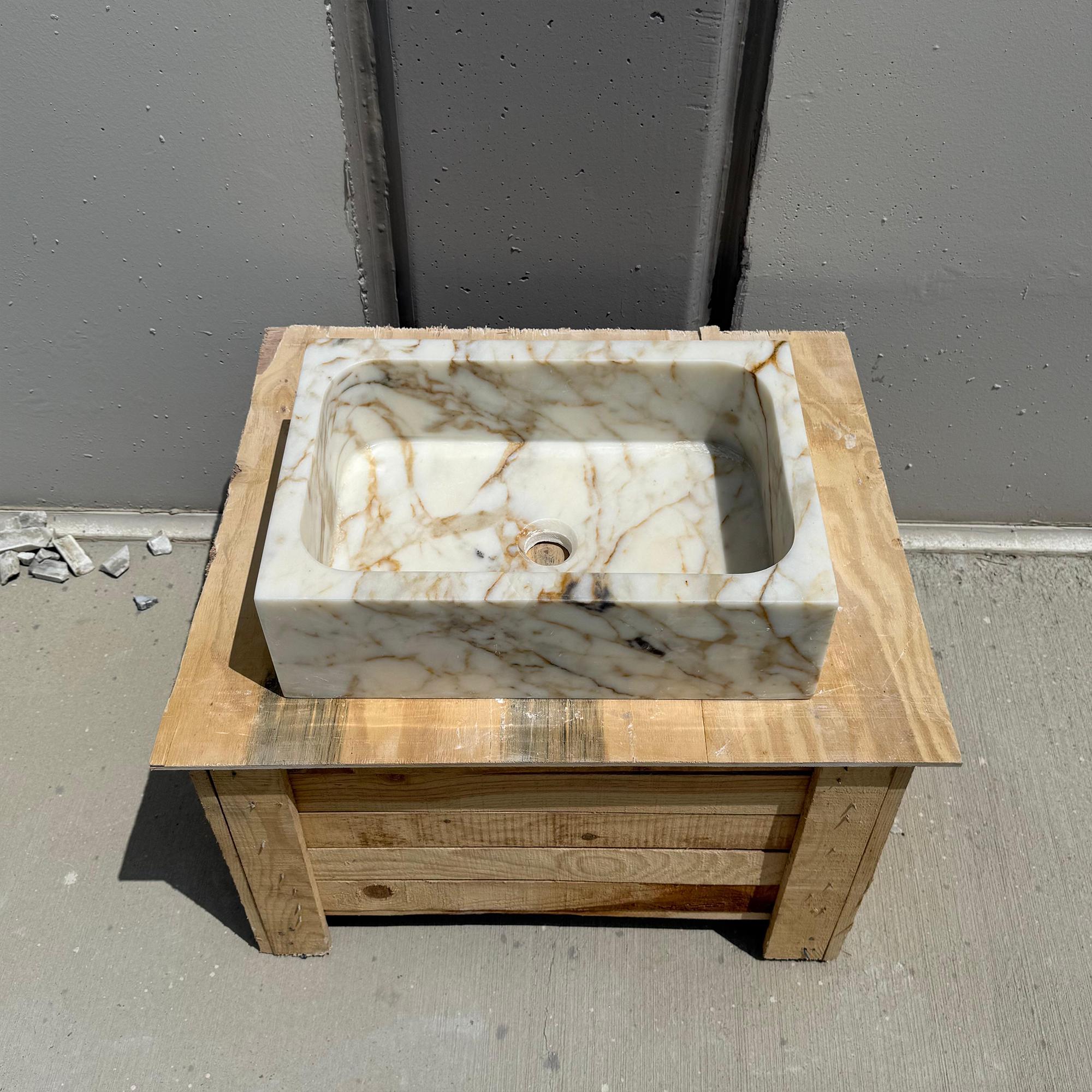Artisan-crafted Calacatta Gold sink for powder room vanities