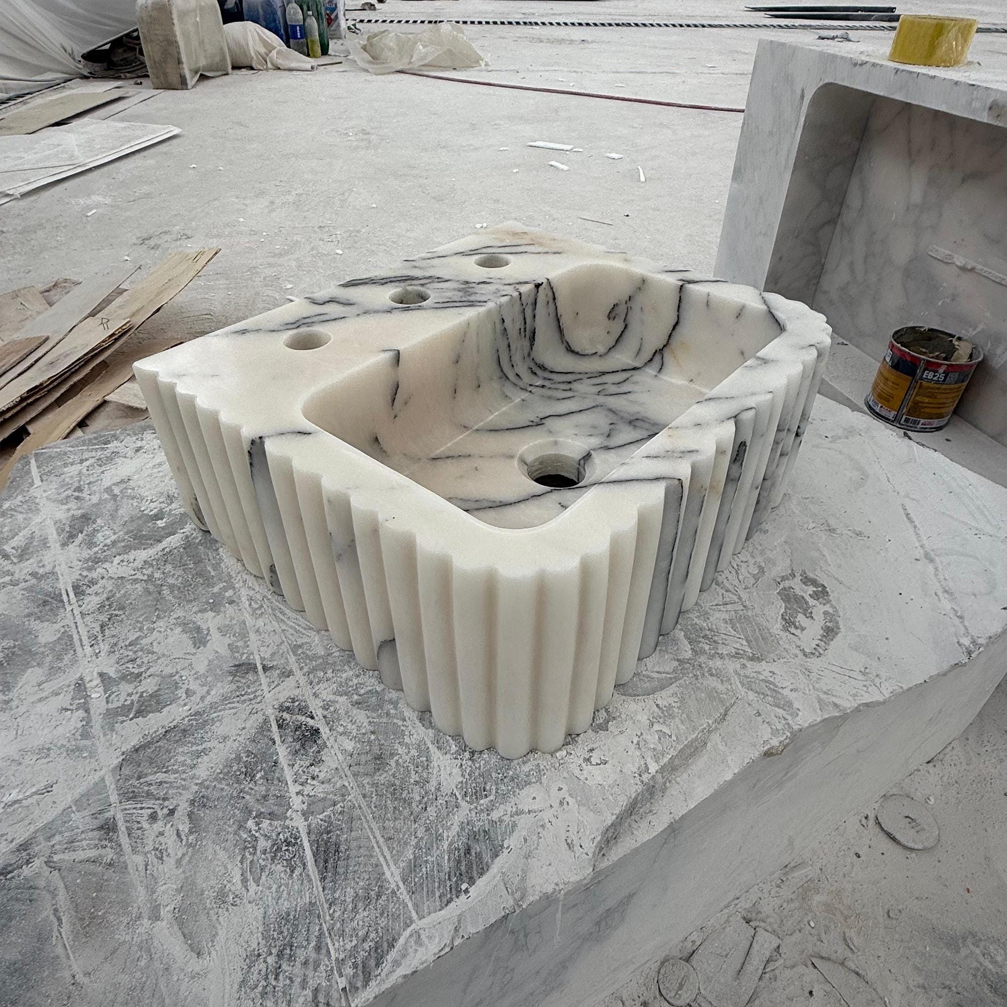 Designer marble bathroom sink with sculptural fluted sides