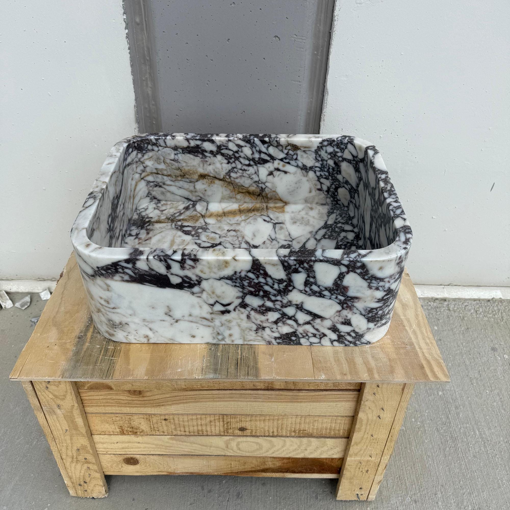 Luxury bathroom sink in dramatic Calacatta Viola stone