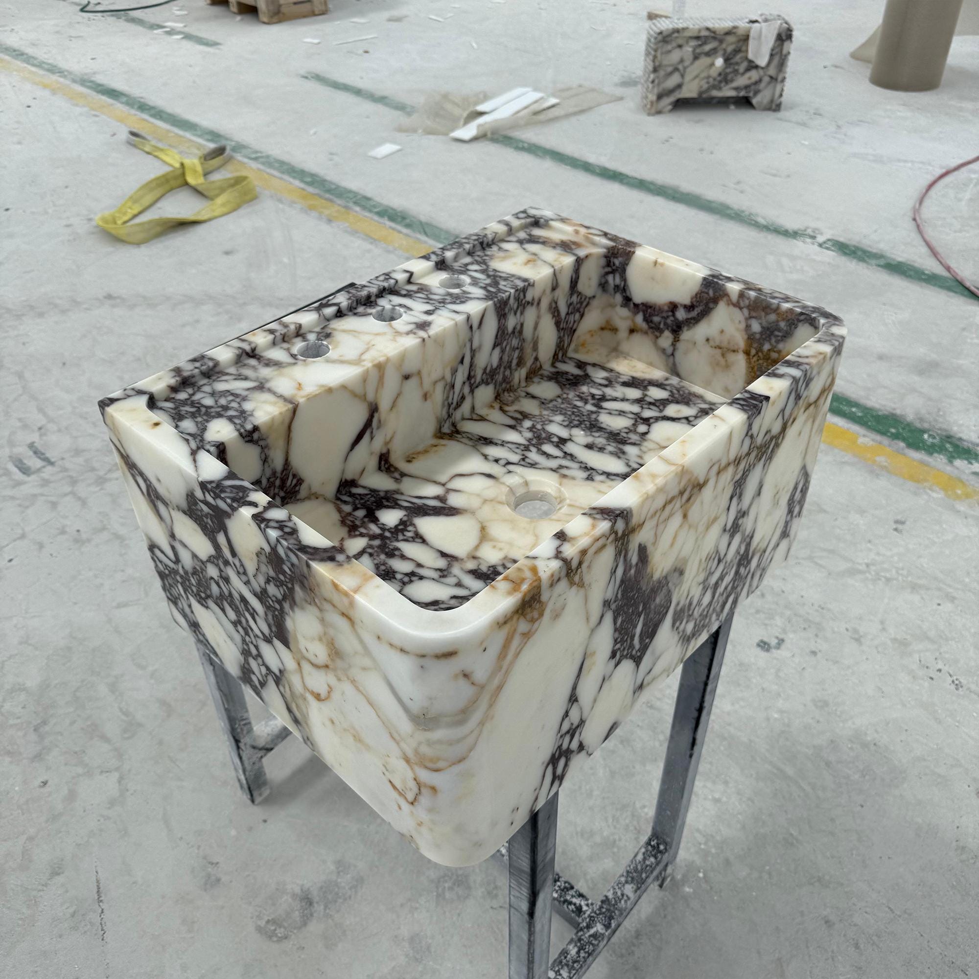 Sculptural luxury vanity sink in dramatic Italian Calacatta Viola marble