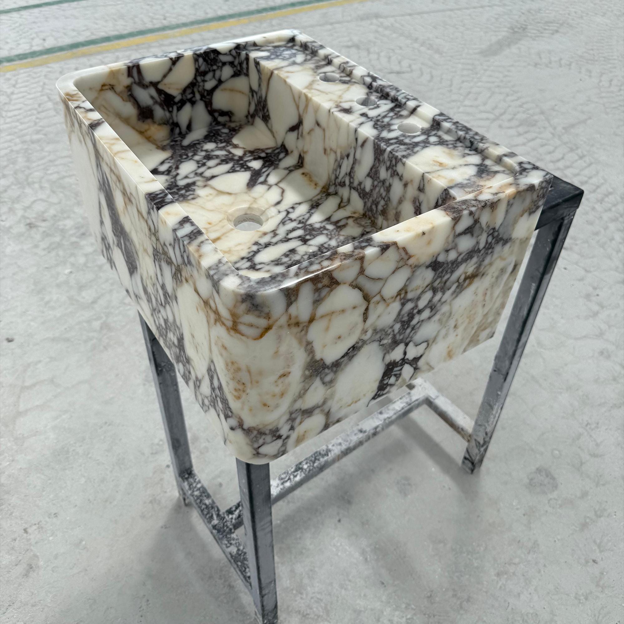 Large Calacatta Viola marble sink with integrated countertop and bold veining