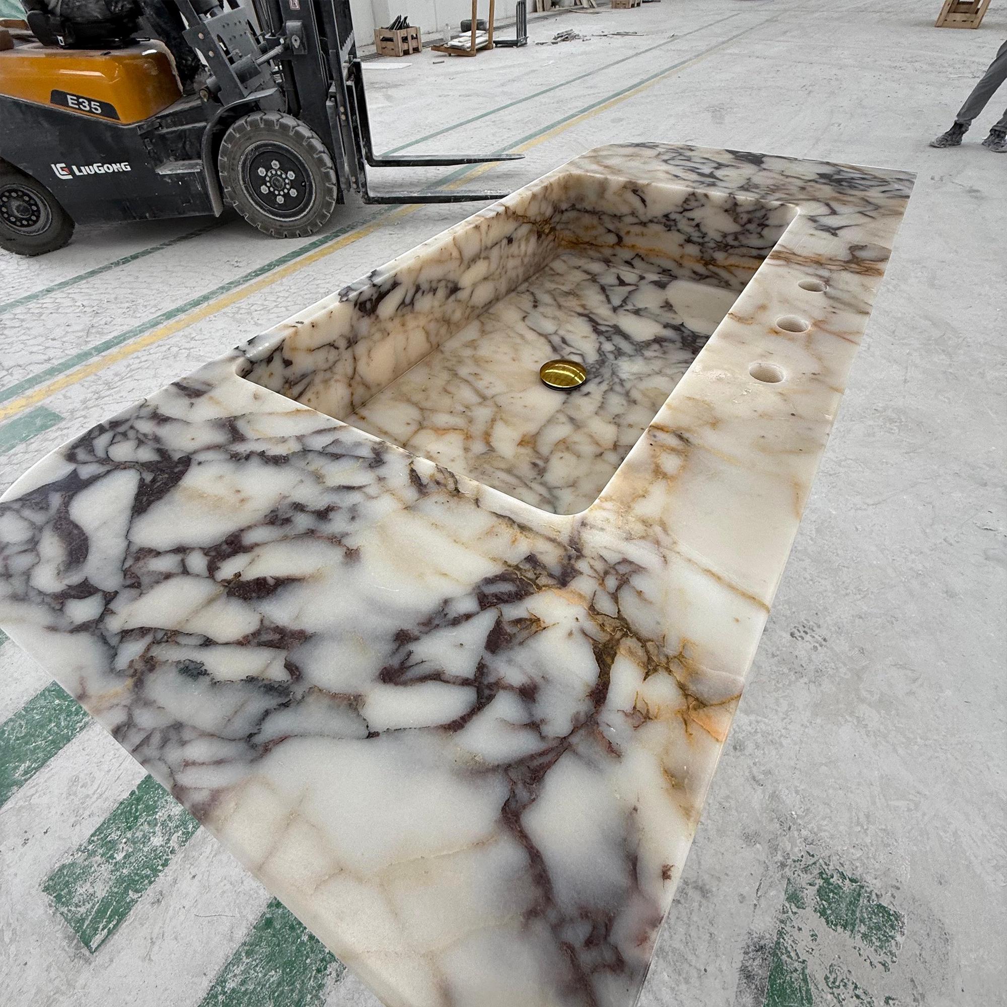 This image captures the raw elegance of a luxury sink before installation in a high-end bathroom.