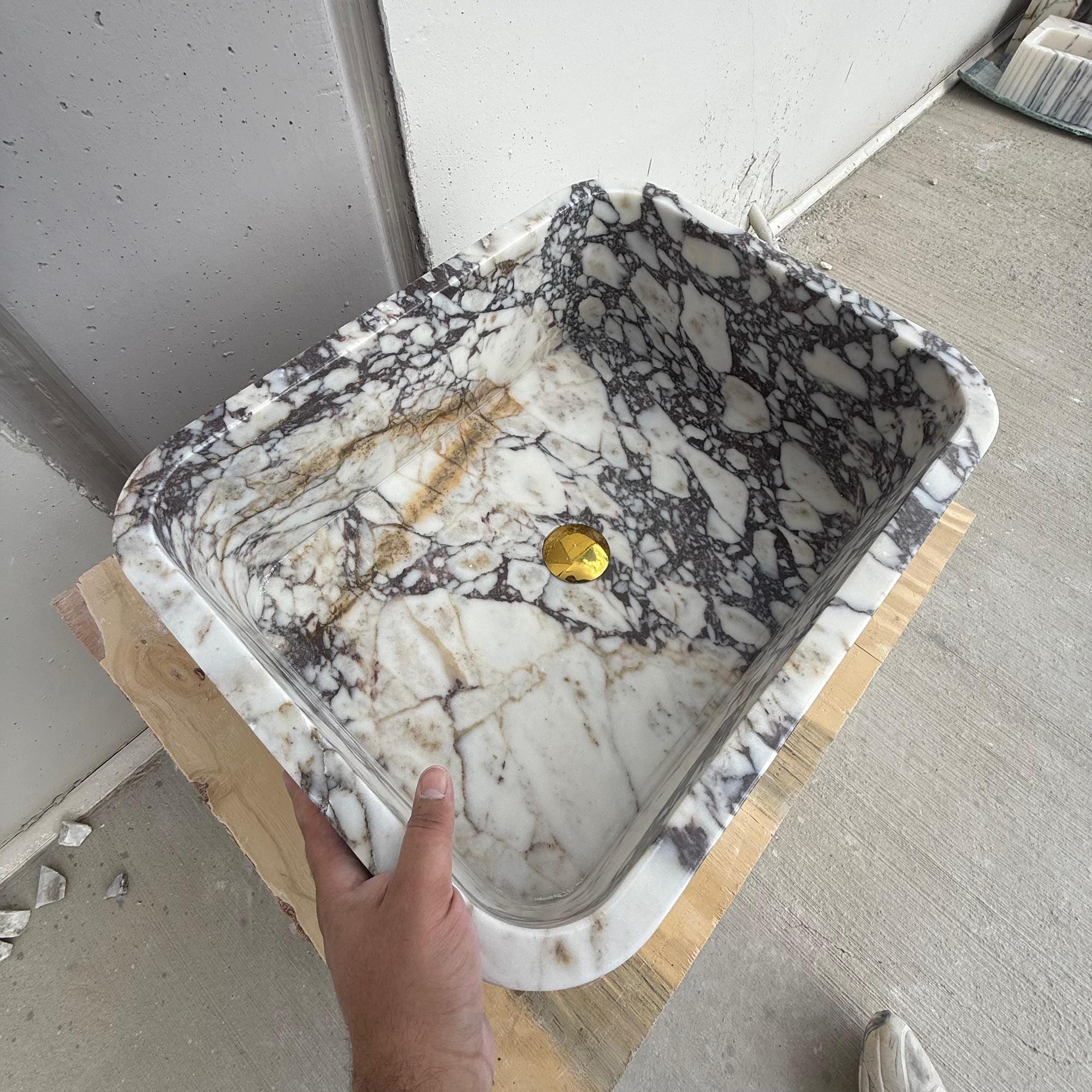 Custom stone sink for modern luxury powder rooms