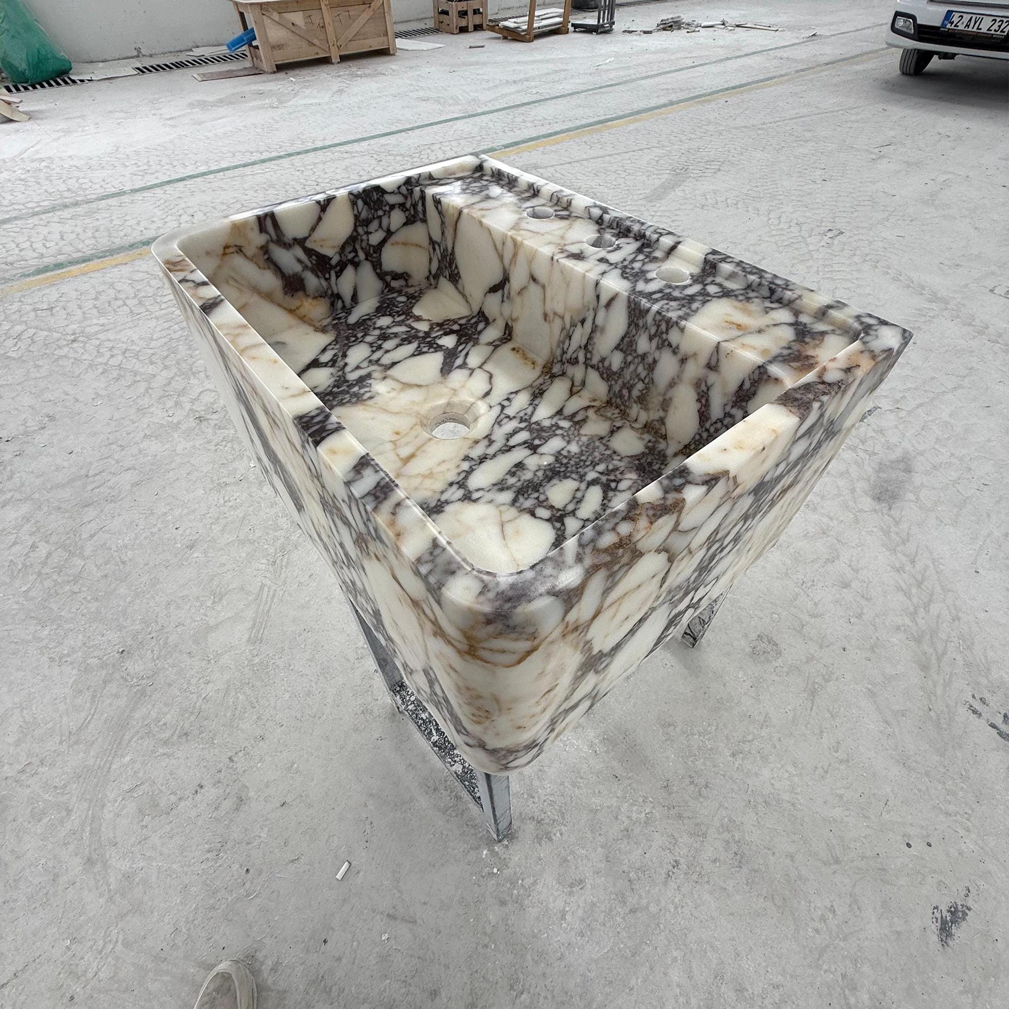 Oversized vanity sink carved from Calacatta Viola natural stone