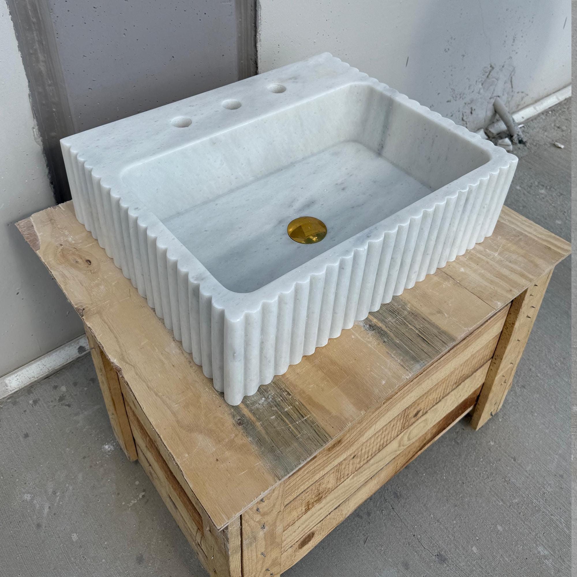 Rectangular white marble basin with elegant ribbed design
