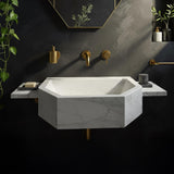 A luxurious Carrara marble wall-mounted sink with octagonal shaping and floating side platforms designed for modern bathrooms.