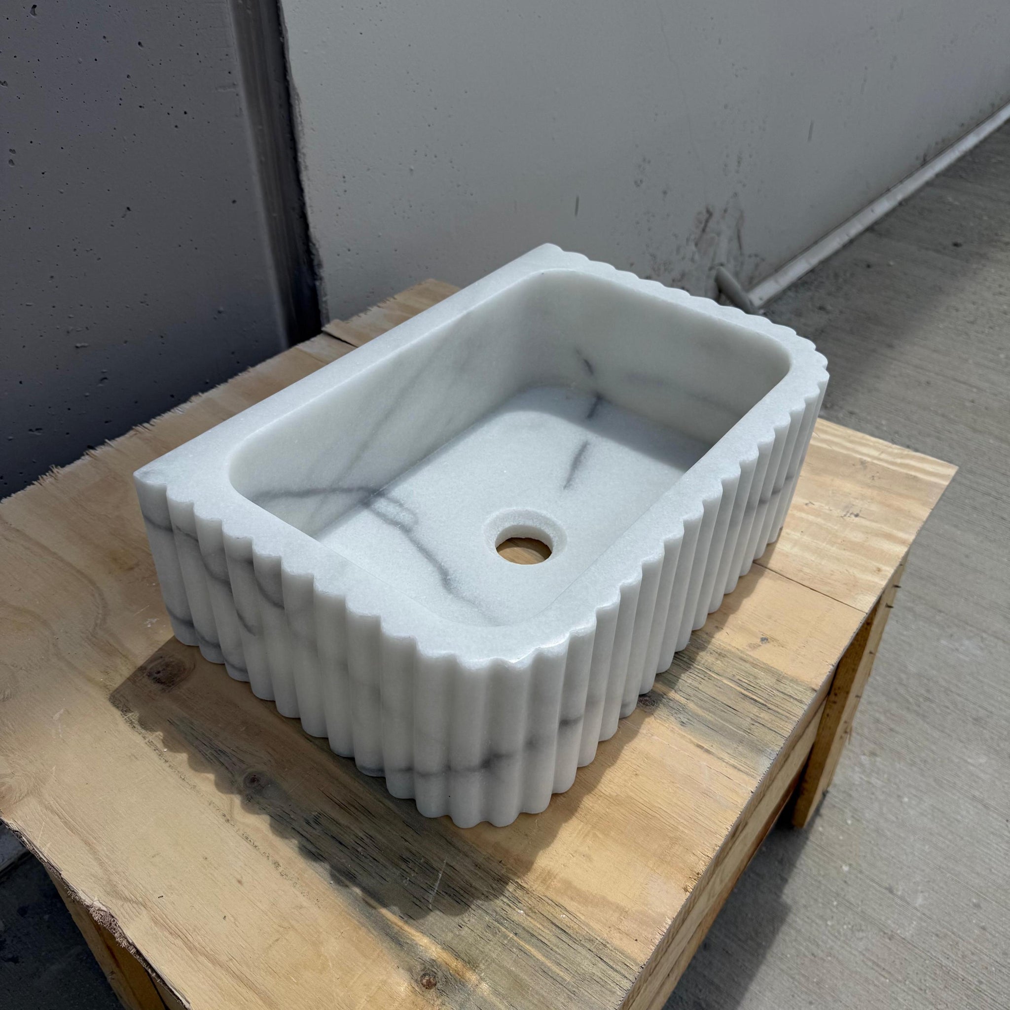 Designer vessel sink in elegant white marble for high-end bathrooms