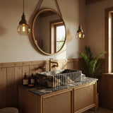 A luxurious fluted sink carved from Picasso marble sits atop a custom wood vanity with cane paneling.