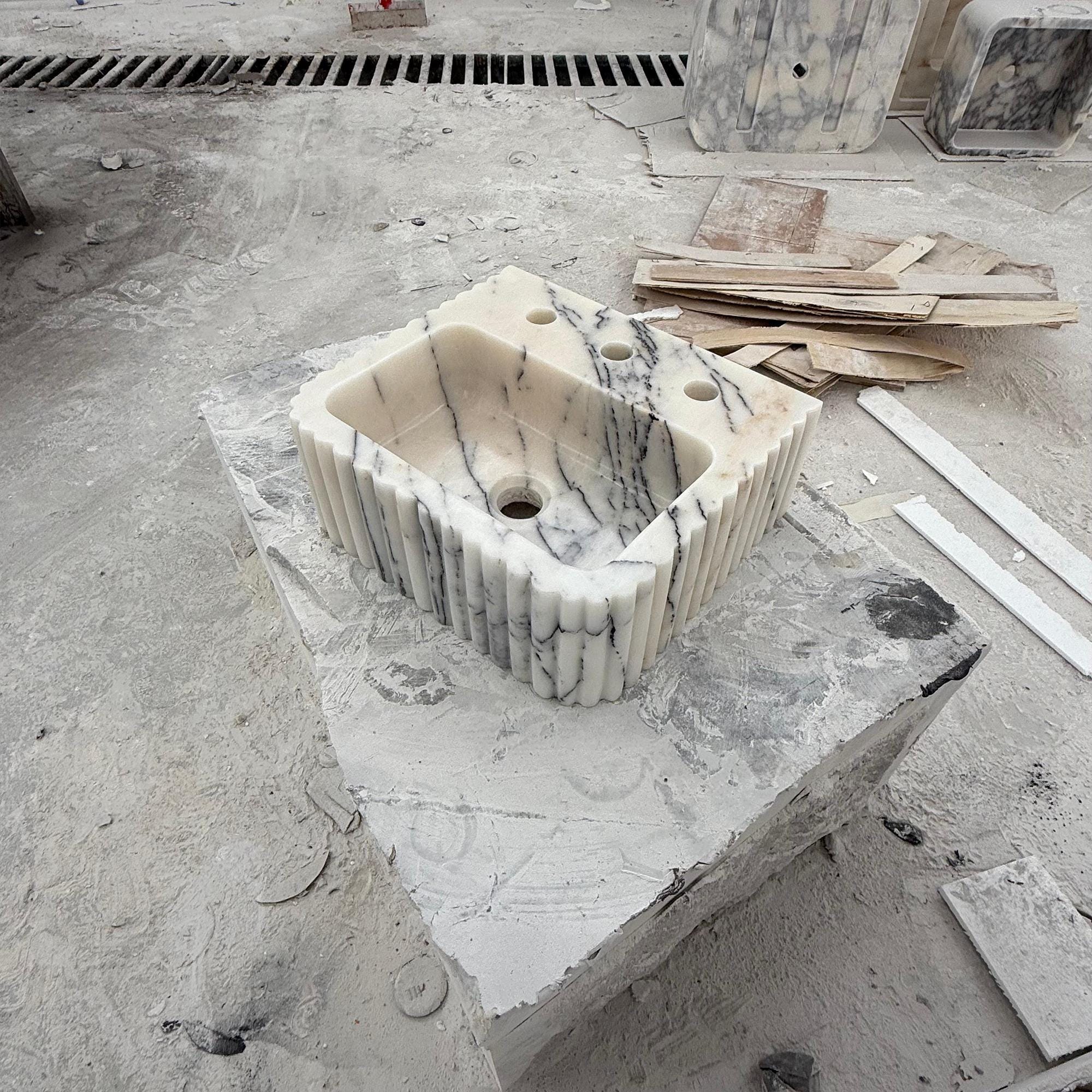 Luxury Calacatta vanity basin featuring artistic stone carving