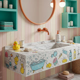 Carrara marble wall-mounted sink with colorful kids’ bathroom doodles