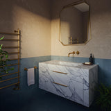 Carrara marble floating vanity with gold handles