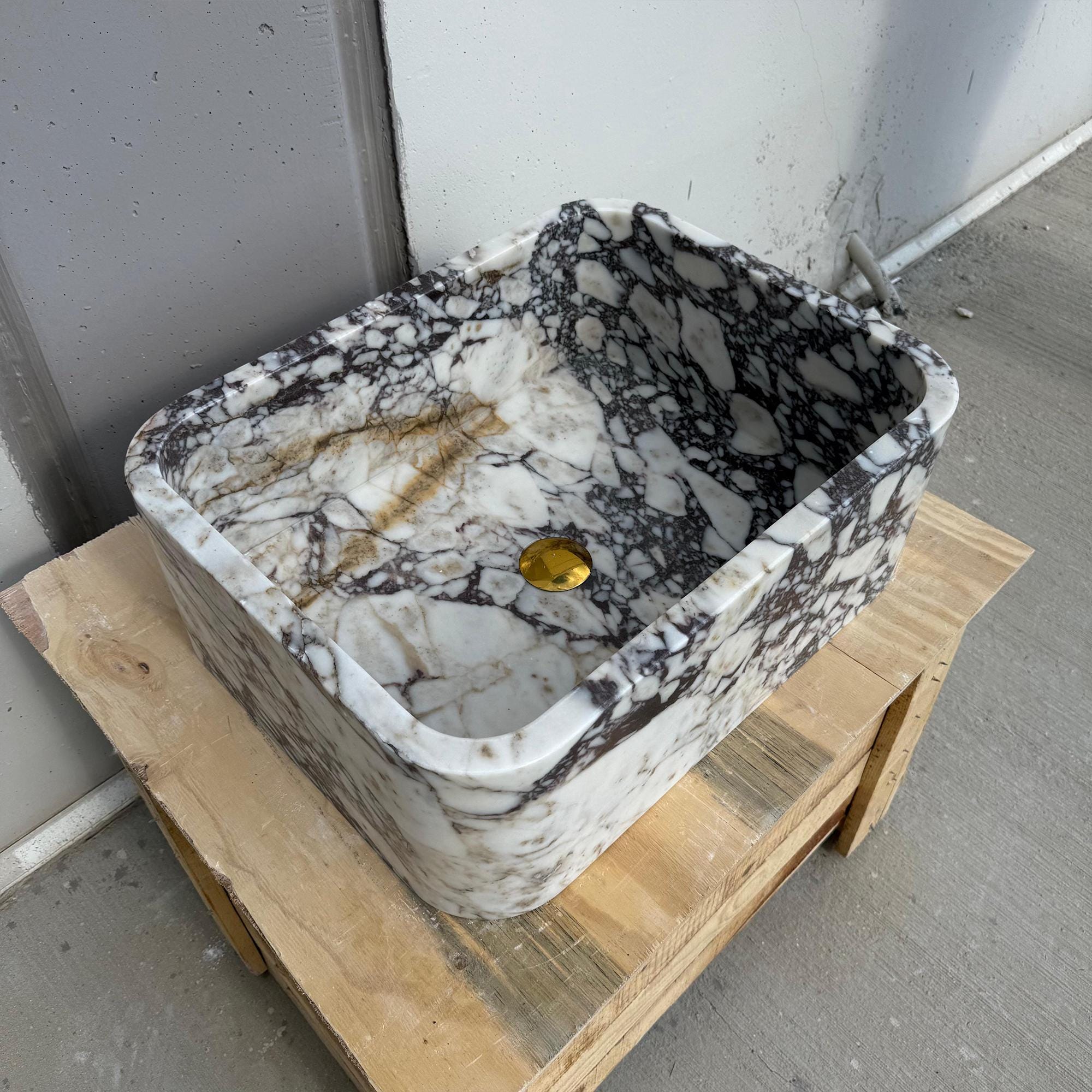 Handcrafted marble vanity basin with bold veining