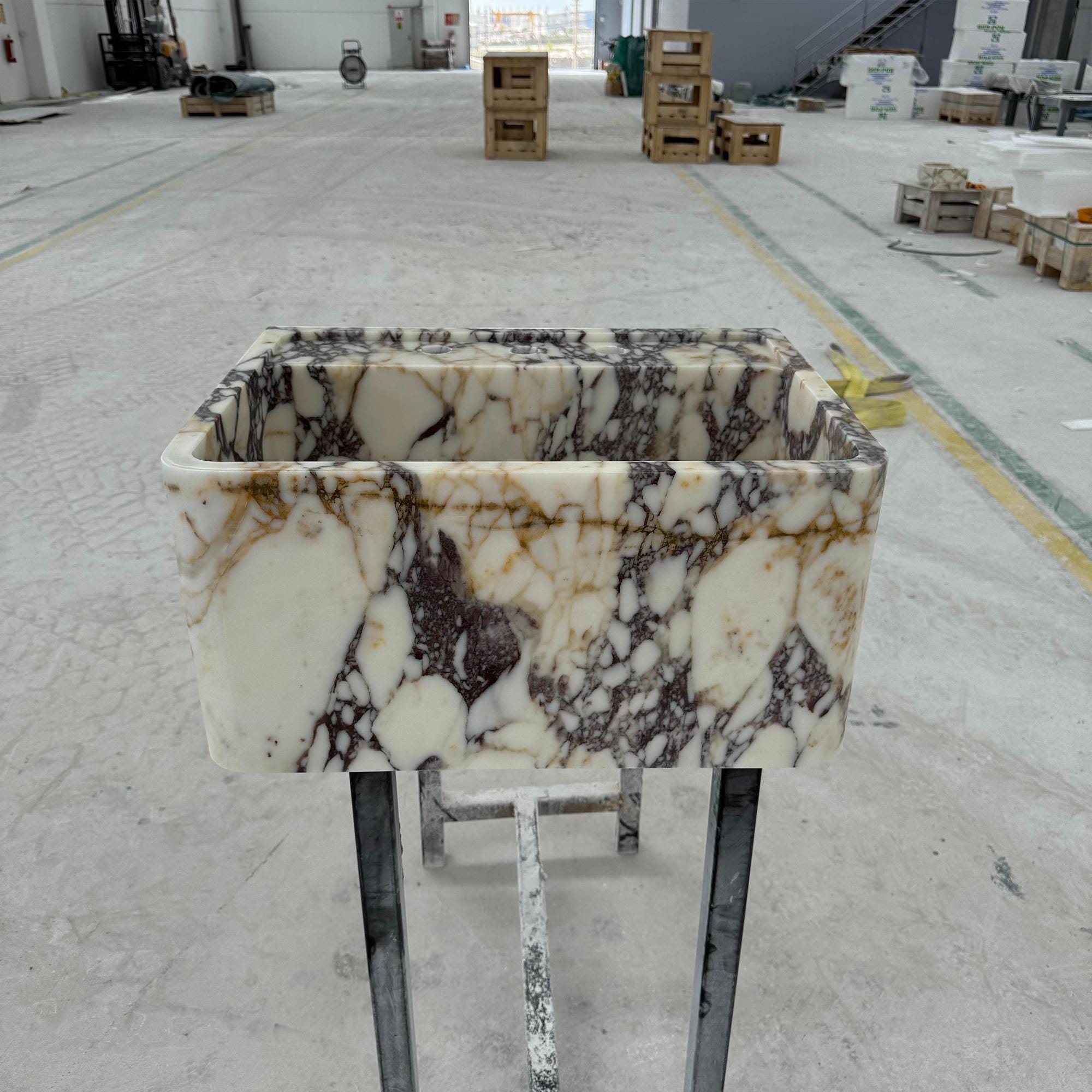 Statement marble basin with rich veining and custom rectangular design