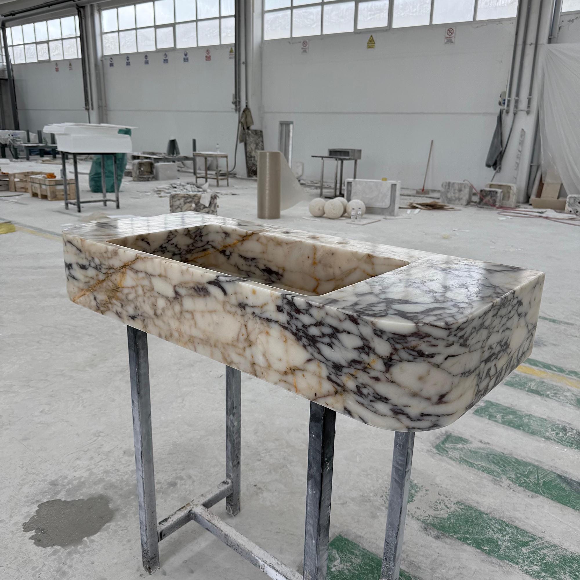 This handcrafted marble trough sink combines modern form with timeless Italian stone.