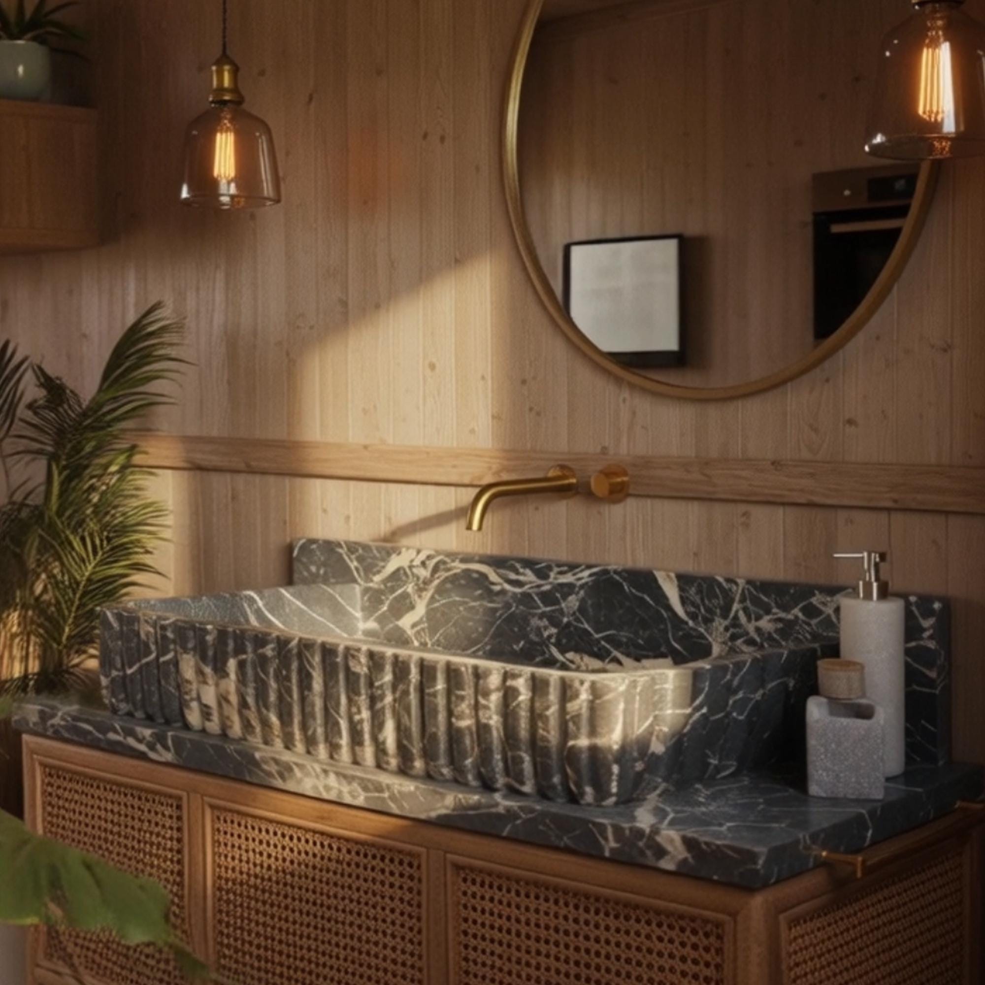 A designer bathroom sink made from dramatic black marble with white veining creates a striking centerpiece.